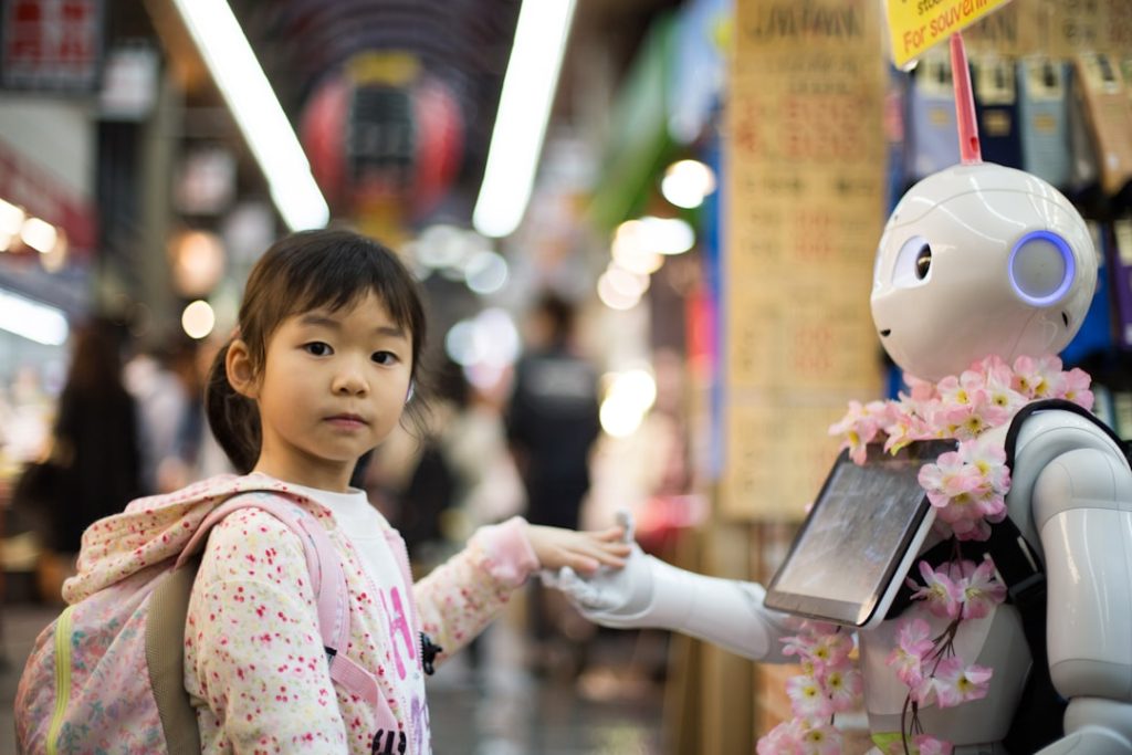 As Kuromon Market in Osaka was about to close for the evening I sampled some delicious king crab and did a final lap of the market when I stumbled upon one of the most Japanese scenes I could possibly imagine, a little girl, making friends with a robot.